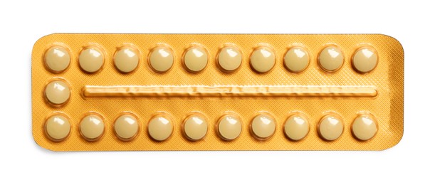 Photo of Birth control pills on white background, top view