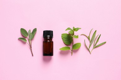 Photo of Bottle of essential oil, sage, rosemary and mint on pink background, flat lay