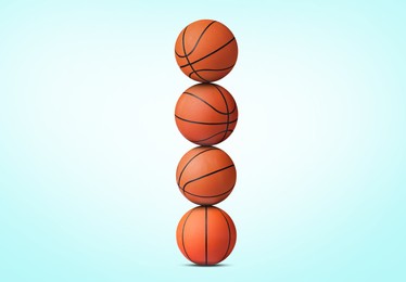 Image of Stack of basketball balls on light blue background