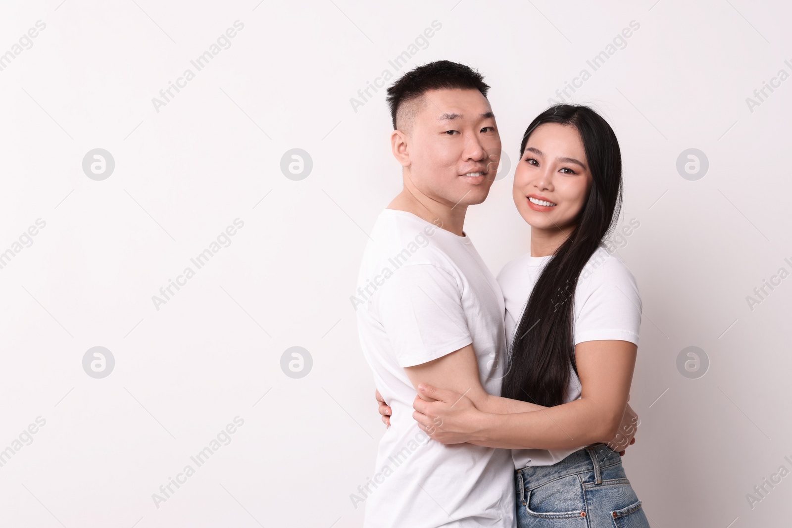 Photo of Portrait of happy couple on white background, space for text