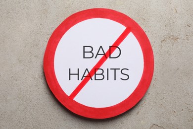 Image of Prohibited symbol with text Bad habits on light grey stone background