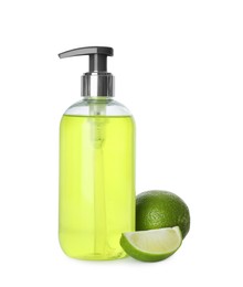 Photo of Dispenser with liquid soap and limes on white background