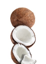 Stack of fresh coconuts on white background