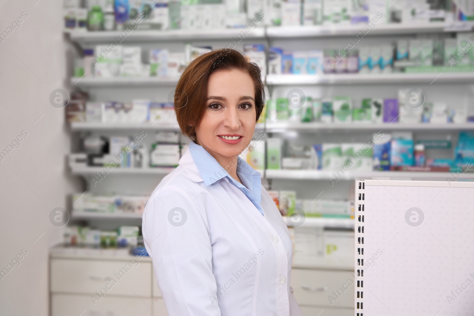 Photo of Portrait of professional pharmacist in modern drugstore