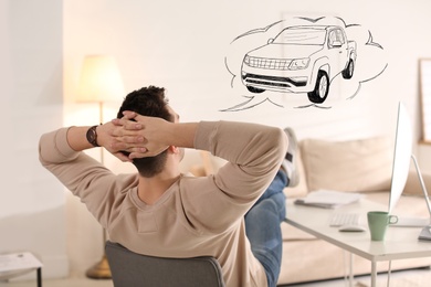 Image of Man dreaming about new car in office during break
