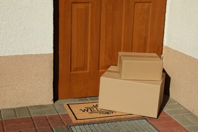 Parcels delivered on mat near front door