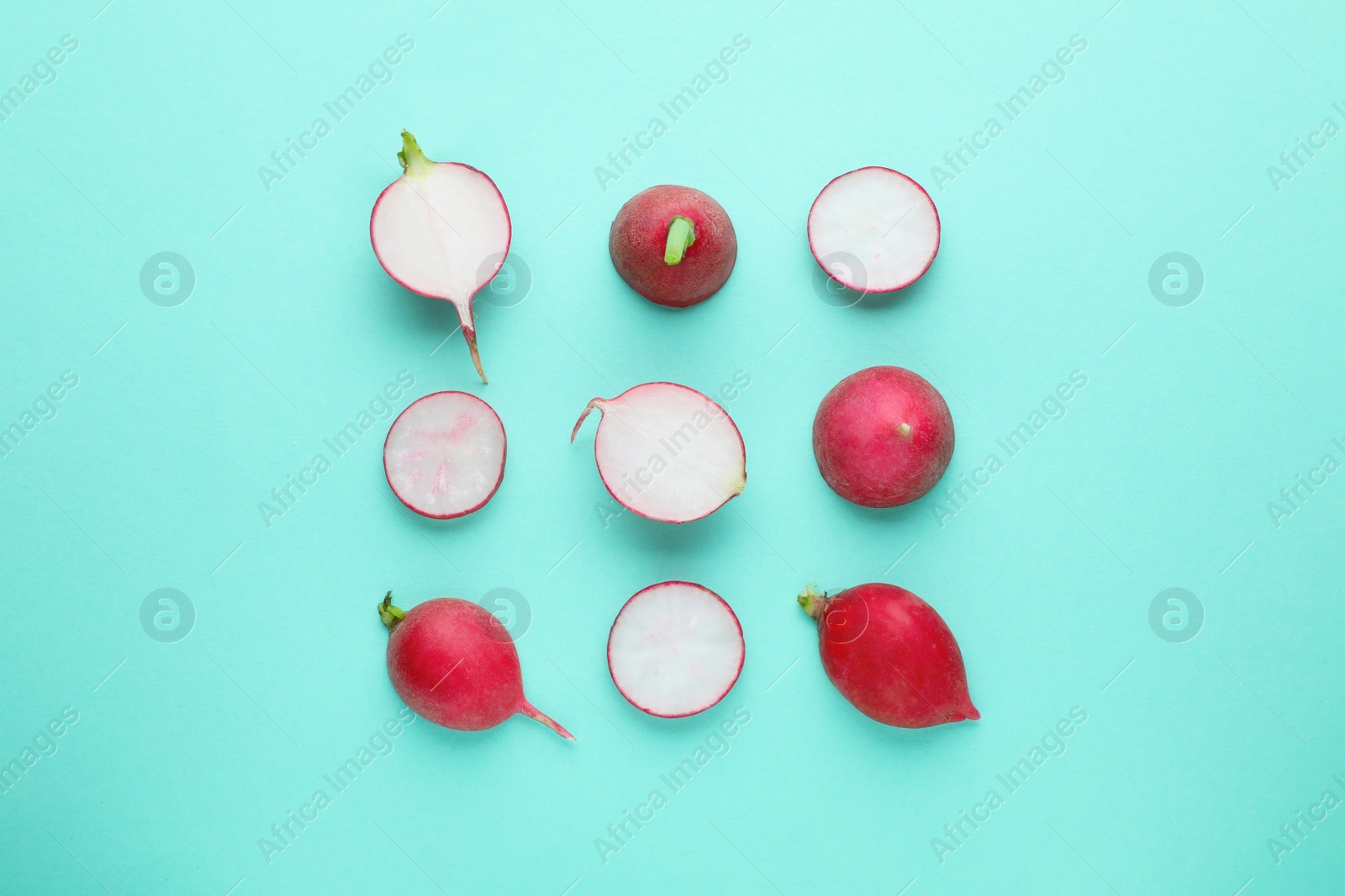 Photo of Fresh ripe radish on turquoise background, flat lay