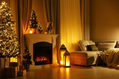 Stylish living room interior with beautiful fireplace, Christmas tree