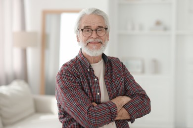 Portrait of happy grandpa with glasses indoors