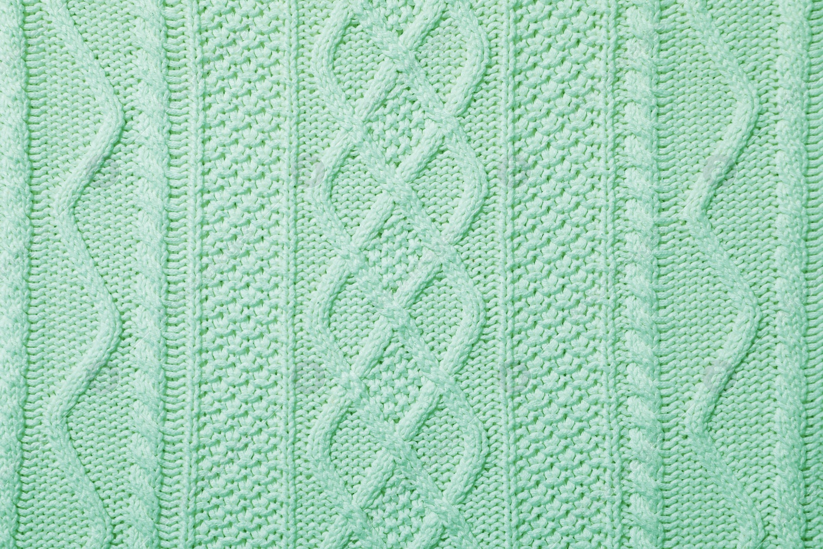 Image of Surface of winter clothing as background. Image toned in mint color 