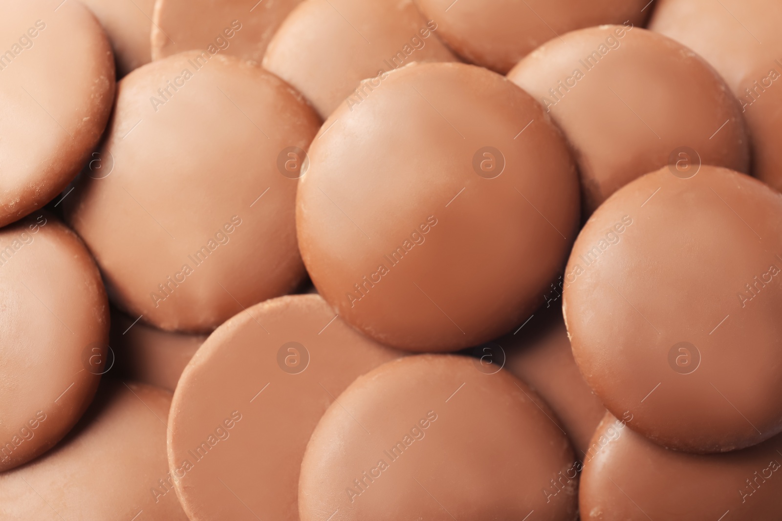 Photo of Many delicious milk chocolate chips, closeup