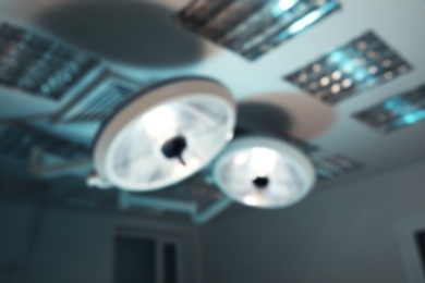 Blurred view of surgical lamps in modern operating room