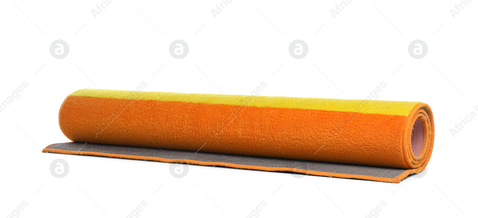 Photo of Rolled colorful carpet on white background. Interior element