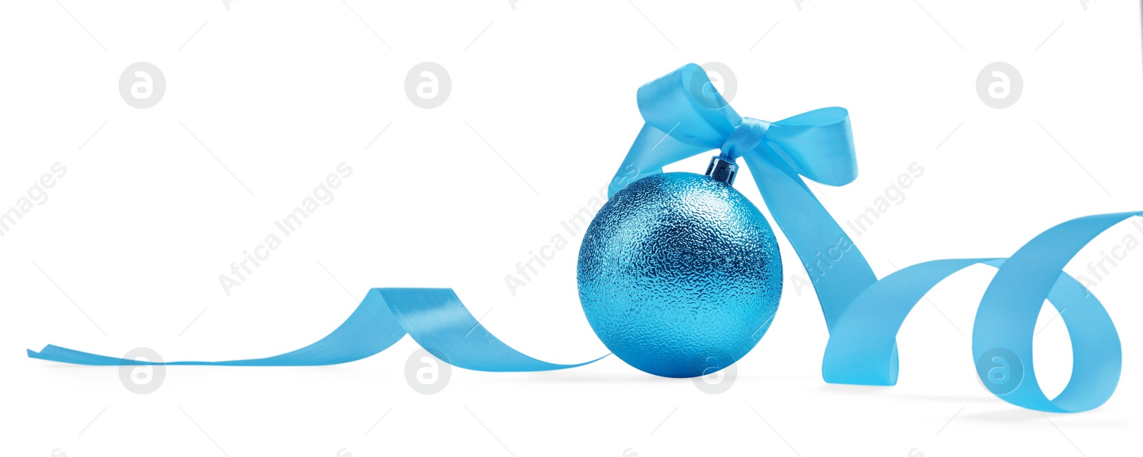 Photo of Beautiful light blue Christmas ball with ribbon isolated on white