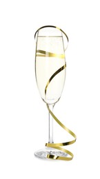 Photo of Glass of champagne and serpentine streamer on white background