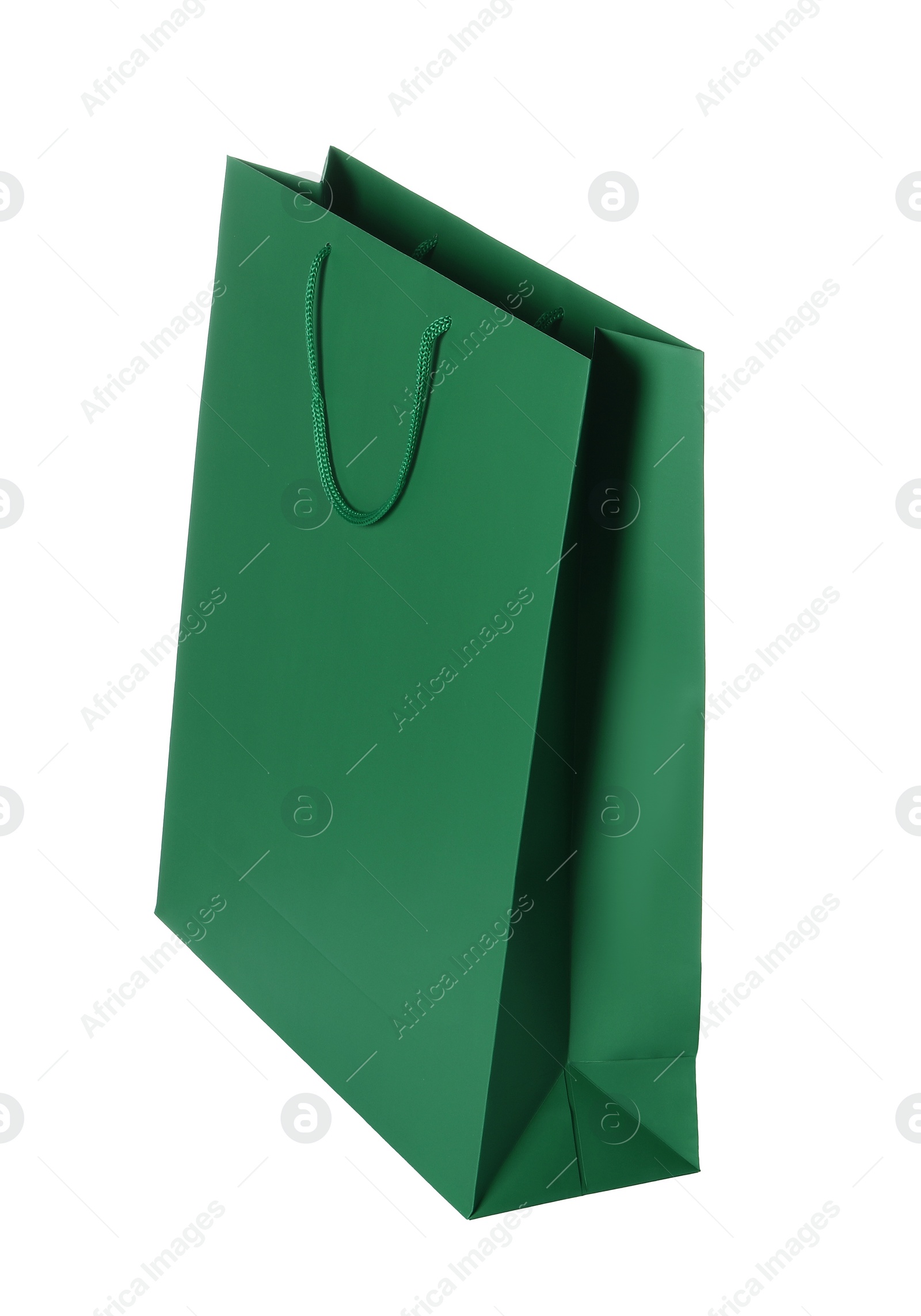 Photo of One green shopping bag isolated on white