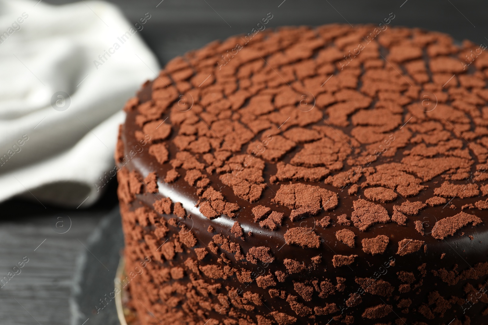 Photo of Delicious chocolate truffle cake on table, closeup