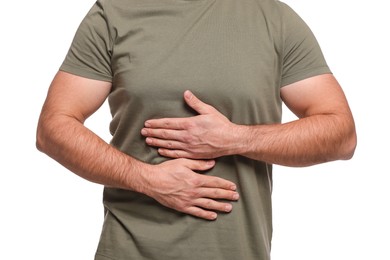 Photo of Man suffering from stomach pain on white background, closeup