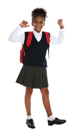 Photo of Happy African-American girl in school uniform on white background