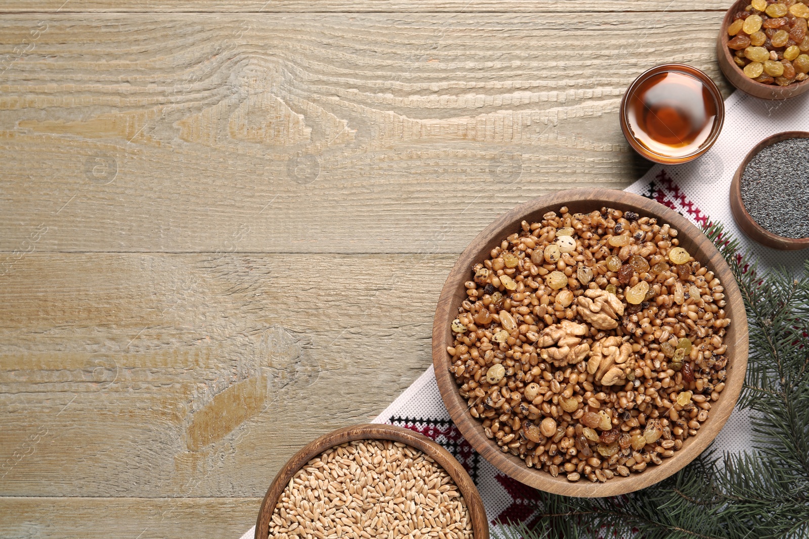 Photo of Flat lay composition with tasty traditional kutia on wooden table, space for text