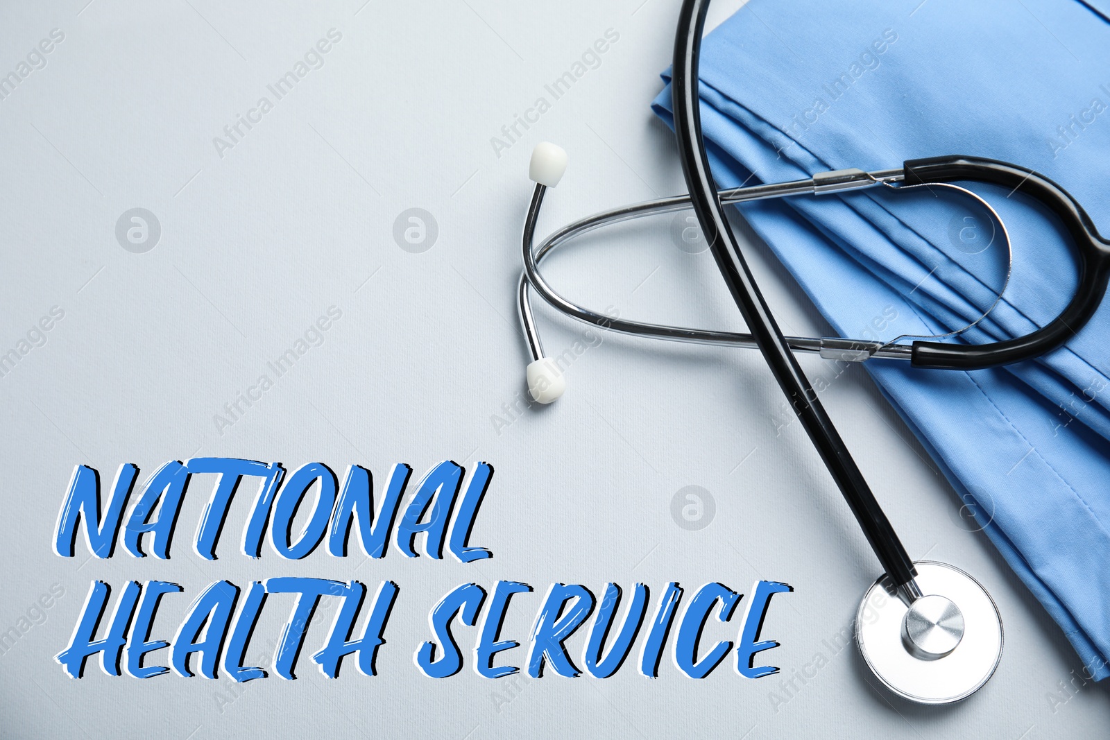 Image of National health service (NHS). Stethoscope, scrubs and text on light grey background, top view