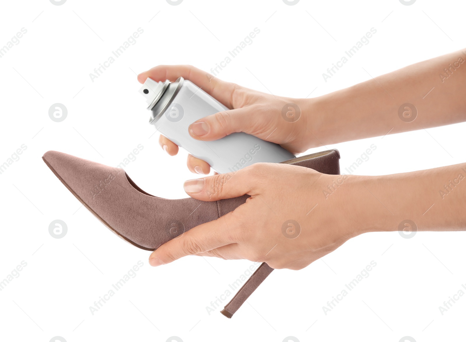 Photo of Woman spraying suede leather shoe on white background, closeup. Footwear care accessory