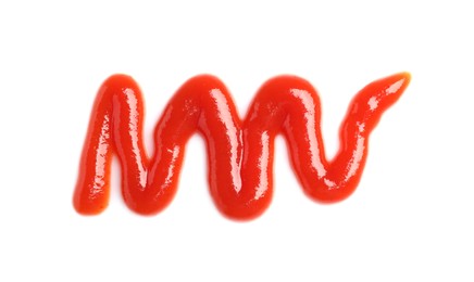 Photo of Smear of tasty ketchup on white background, top view. Ingredient for hot dog