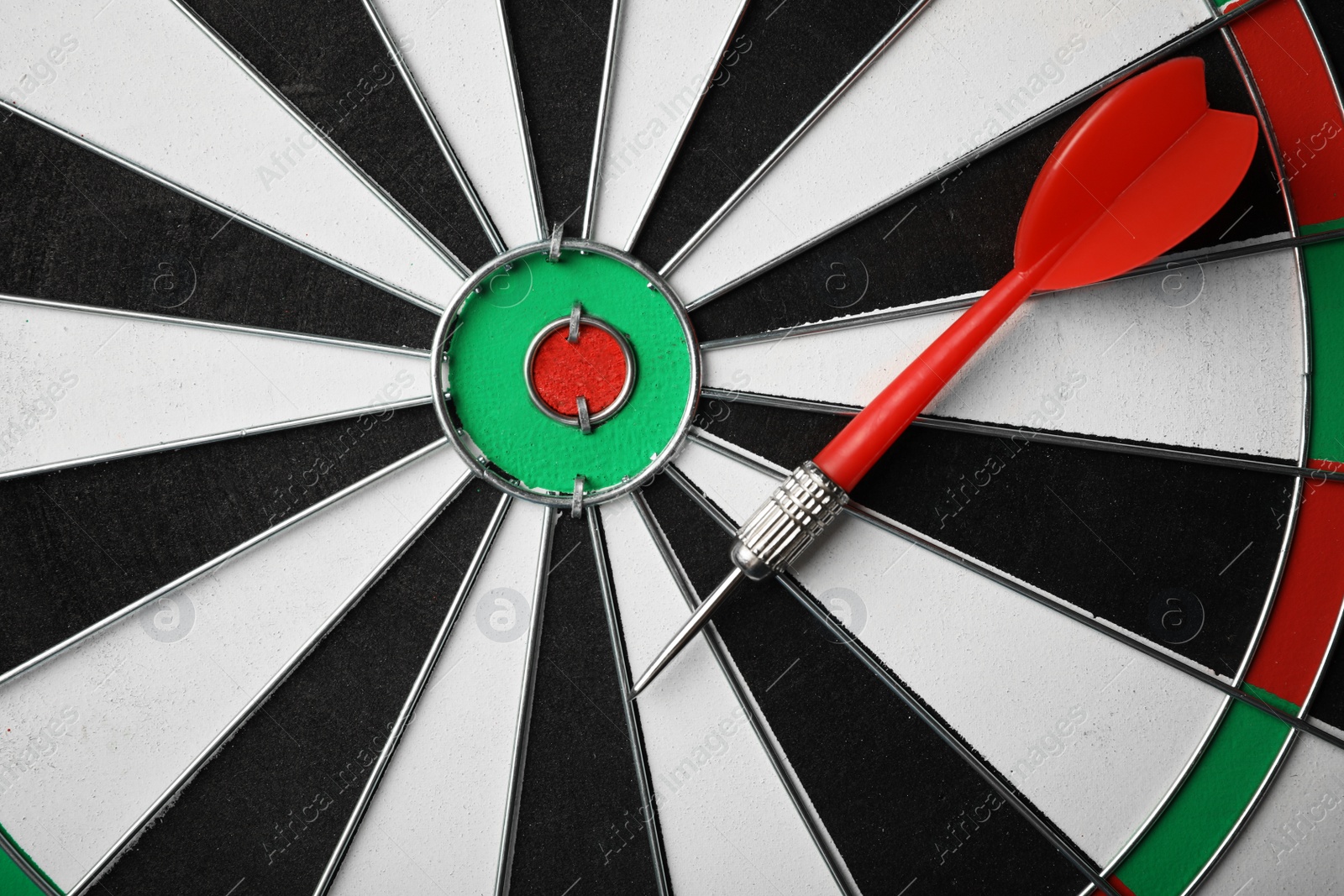 Photo of Red arrow on dart board, top view