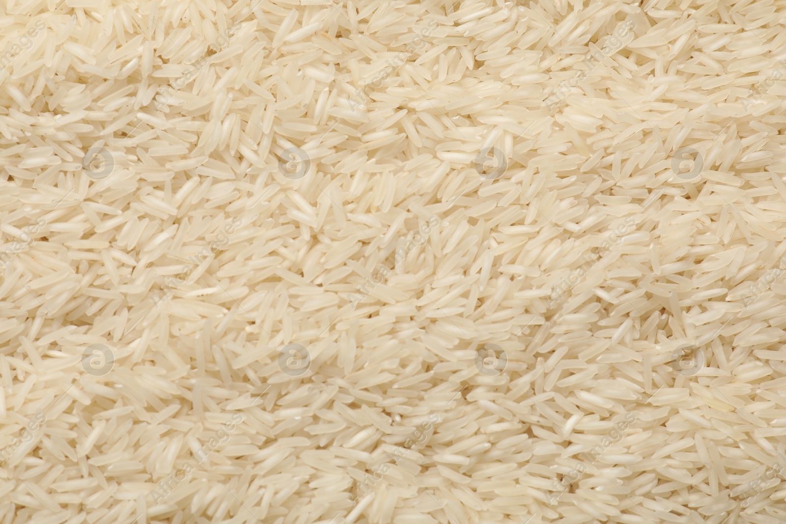 Photo of Raw basmati rice as background, top view