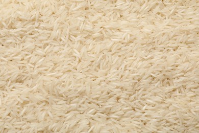 Photo of Raw basmati rice as background, top view