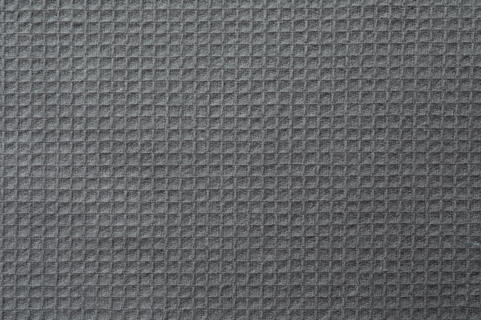 Photo of Texture of grey knitted fabric as background, top view