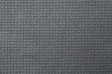 Texture of grey knitted fabric as background, top view