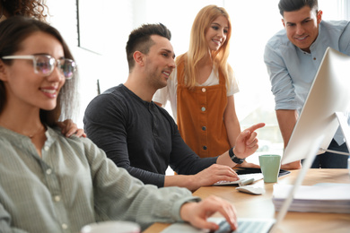 Photo of Team of professional designers working in office