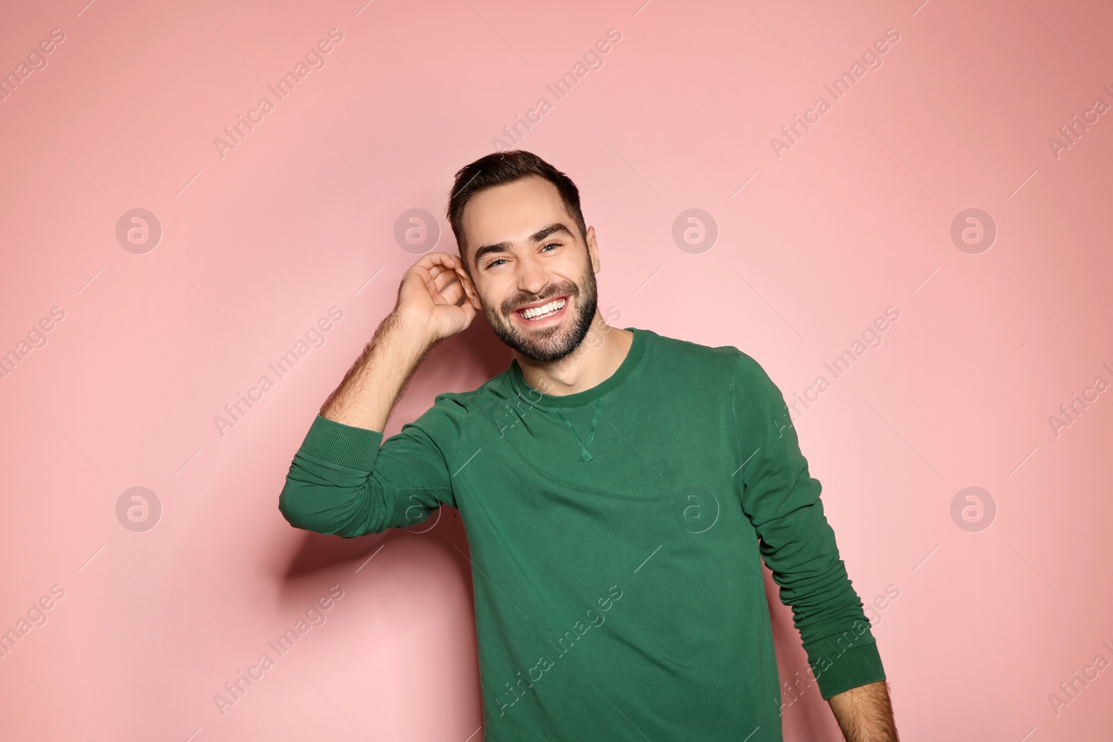 Photo of Portrait of handsome young man on color background