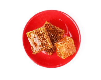 Photo of Plate with delicious honeycomb pieces isolated on white, top view