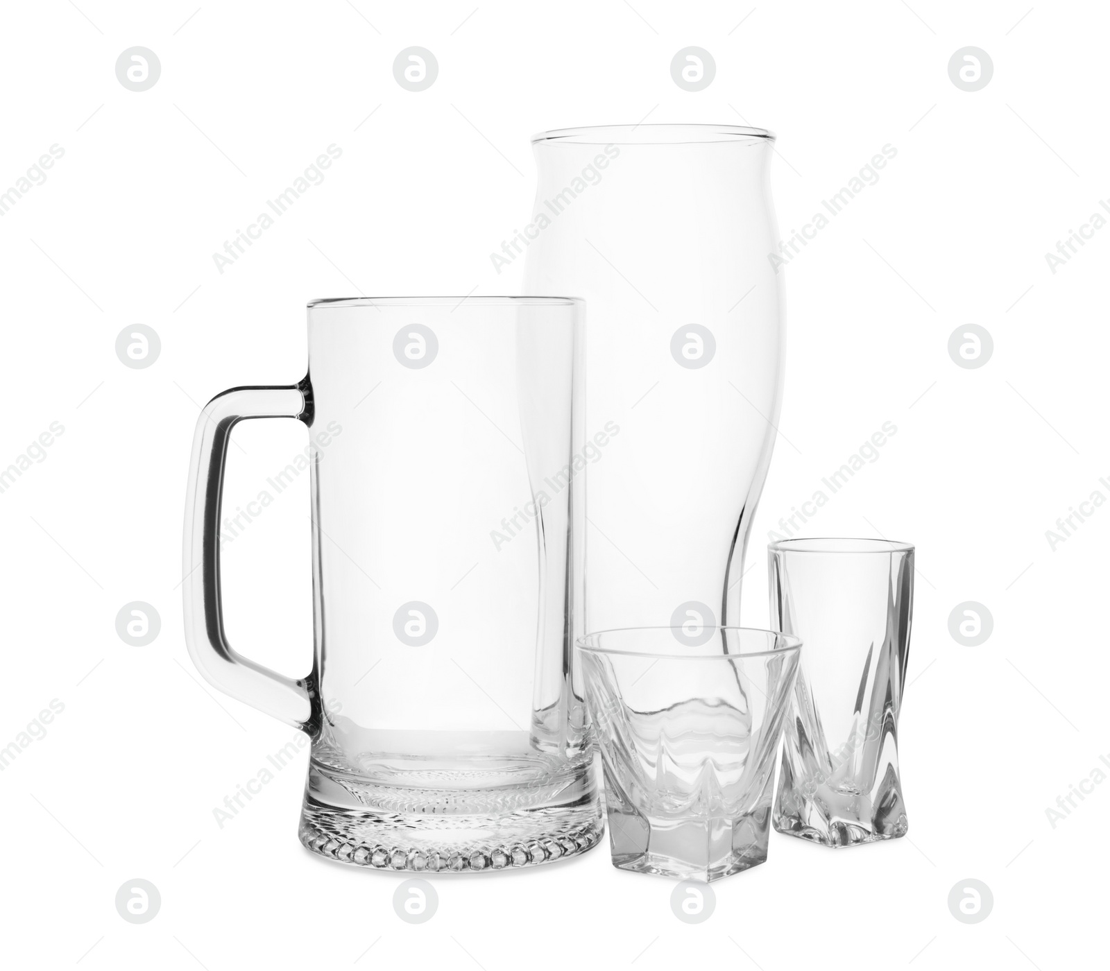 Photo of Different elegant empty glasses isolated on white