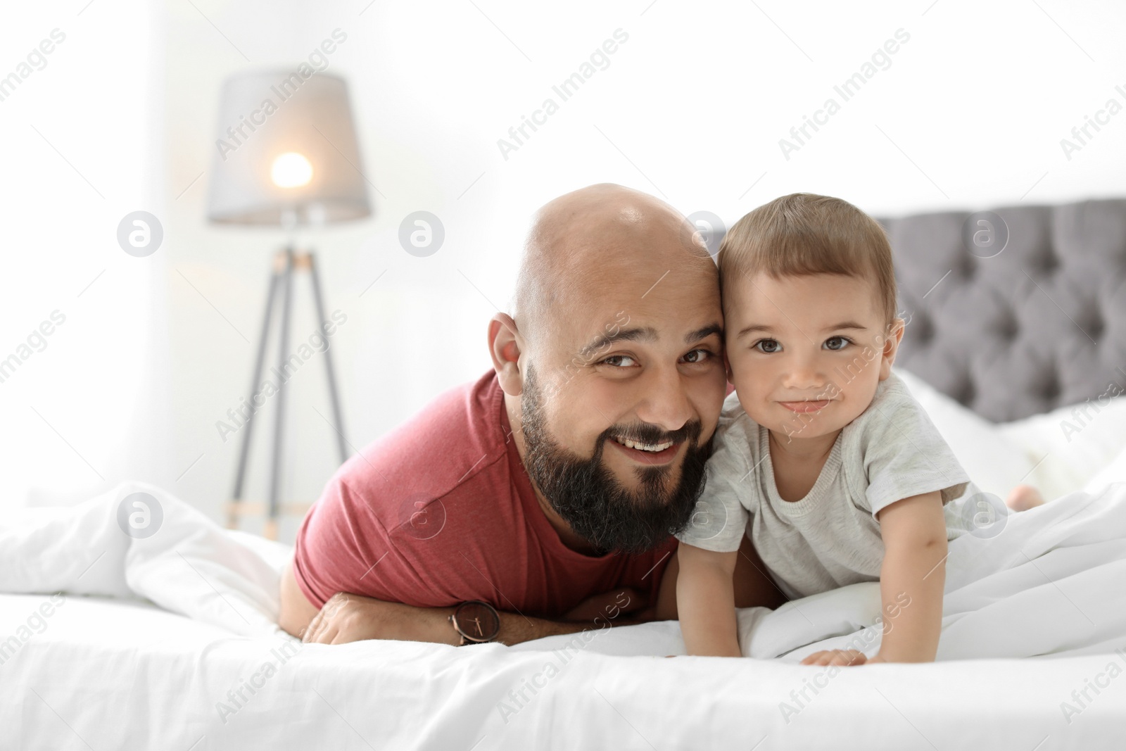 Photo of Dad and his little son spending time together at home