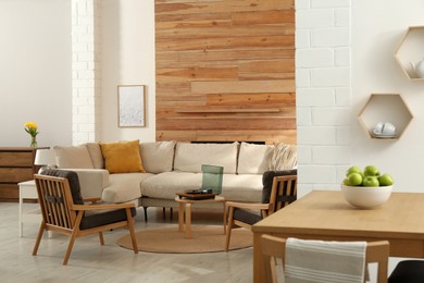 Photo of Stylish sofa in living room. Interior design