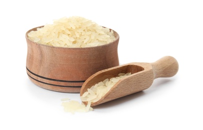 Photo of Bowl and scoop with uncooked rice on white background