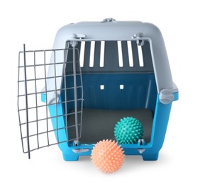 Light blue pet carrier with toys isolated on white