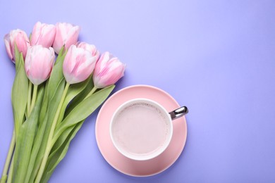 Cup of hot drink and beautiful tulips on light purple background, flat lay. Space for text