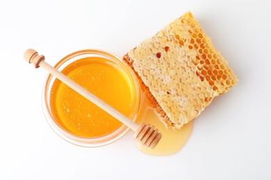 Photo of Composition with fresh honey on white background, top view