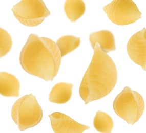 Raw conchiglie pasta flying on white background