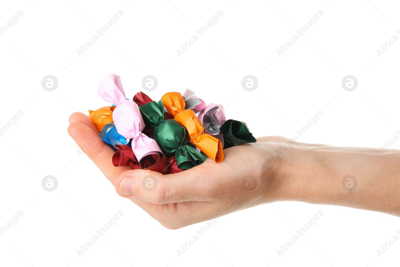 Photo of Woman holding heap of candies in colorful wrappers isolated on white, closeup