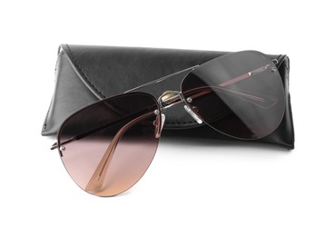 Photo of Stylish sunglasses and black leather case on white background