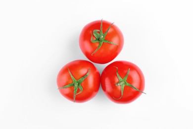 Ripe tomatoes on white background, top view