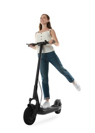 Photo of Happy woman riding modern electric kick scooter on white background