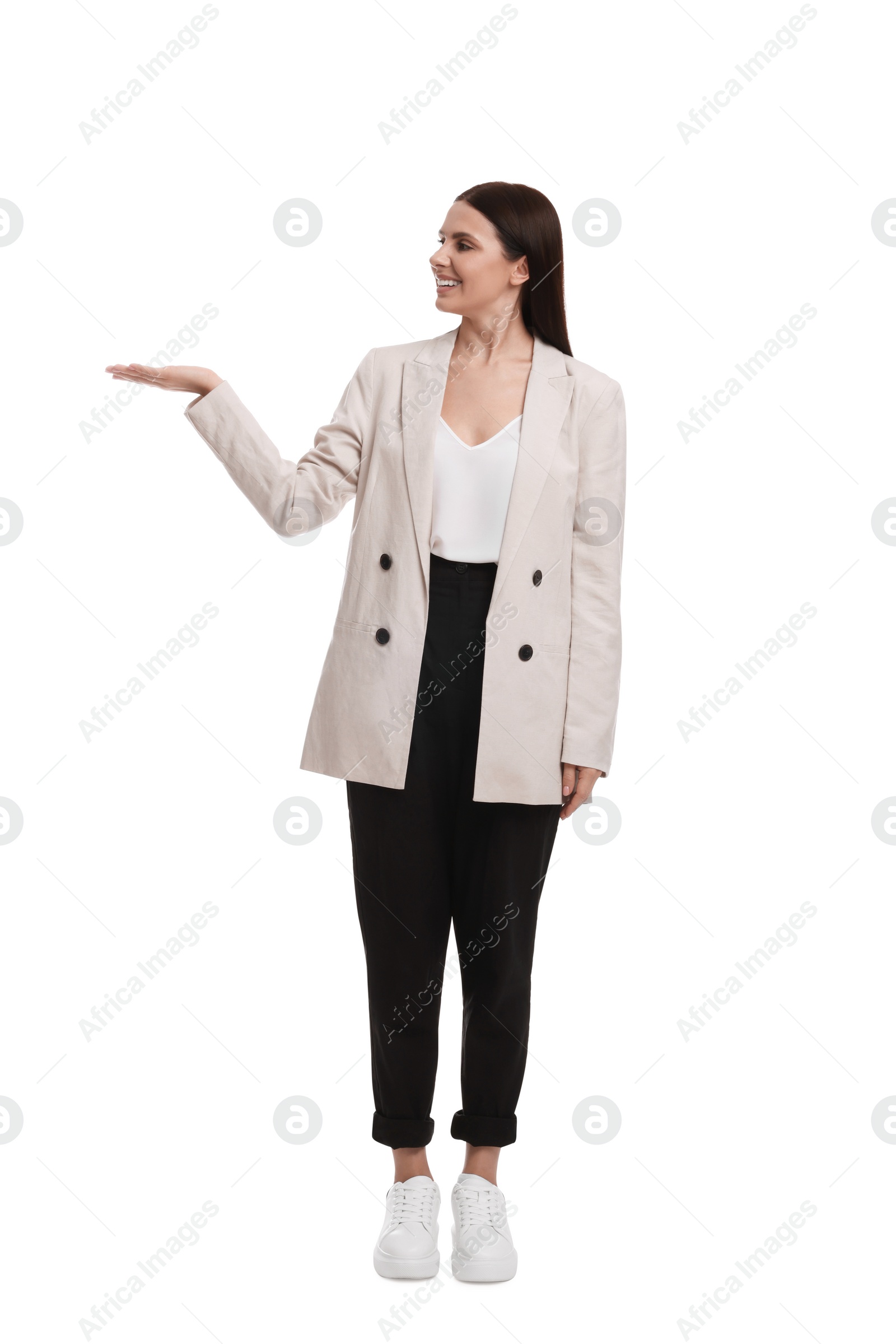 Photo of Beautiful businesswoman in suit pointing at something on white background