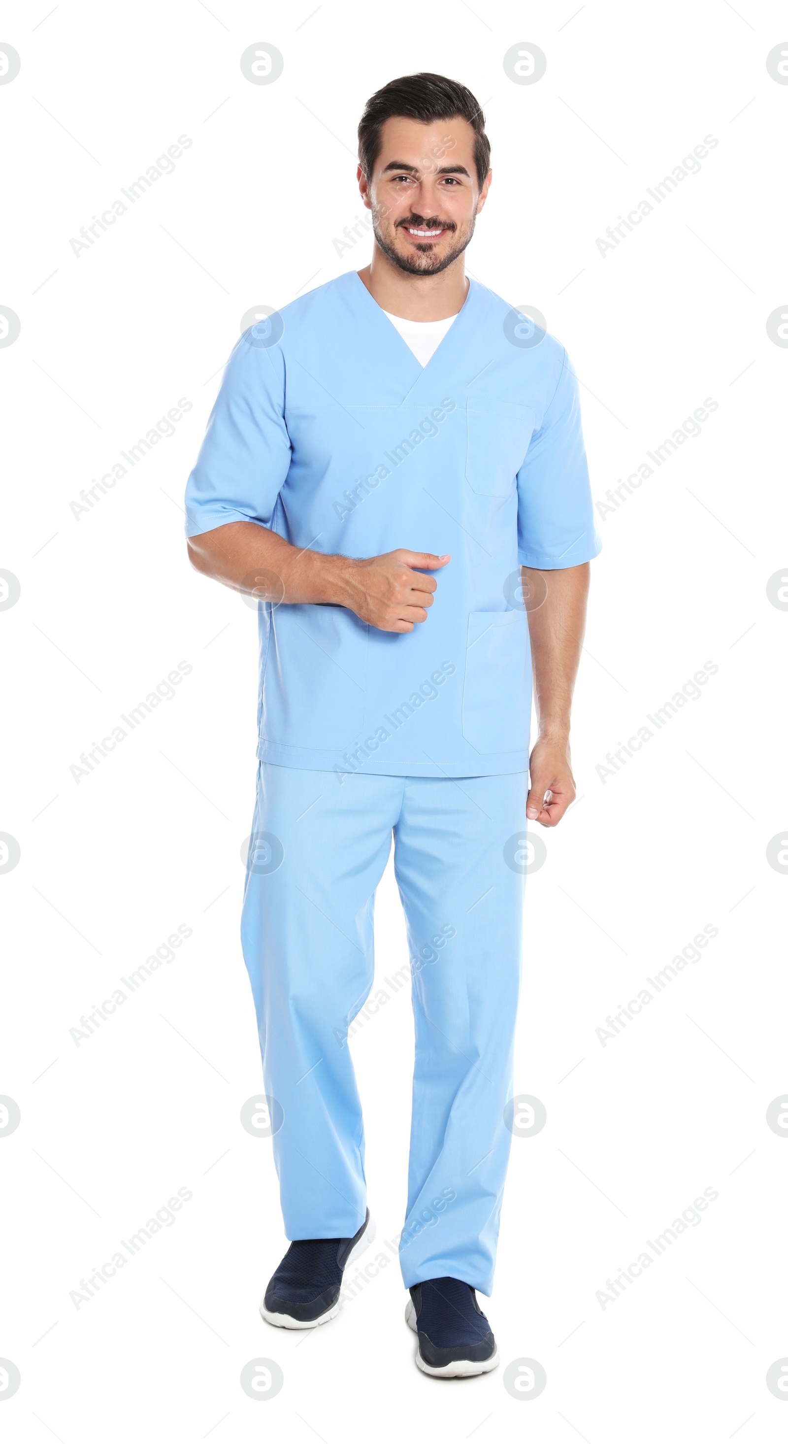 Photo of Young male doctor in uniform on white background. Medical service