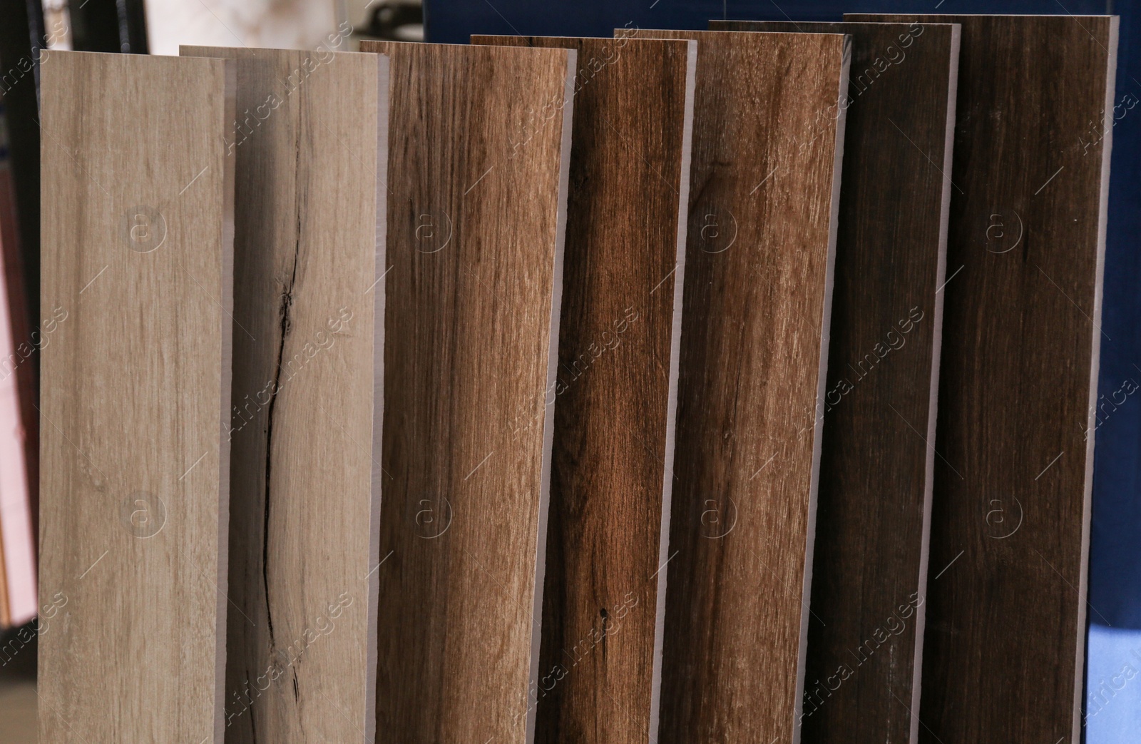 Photo of Samples of different wooden planks in store. Total wholesale